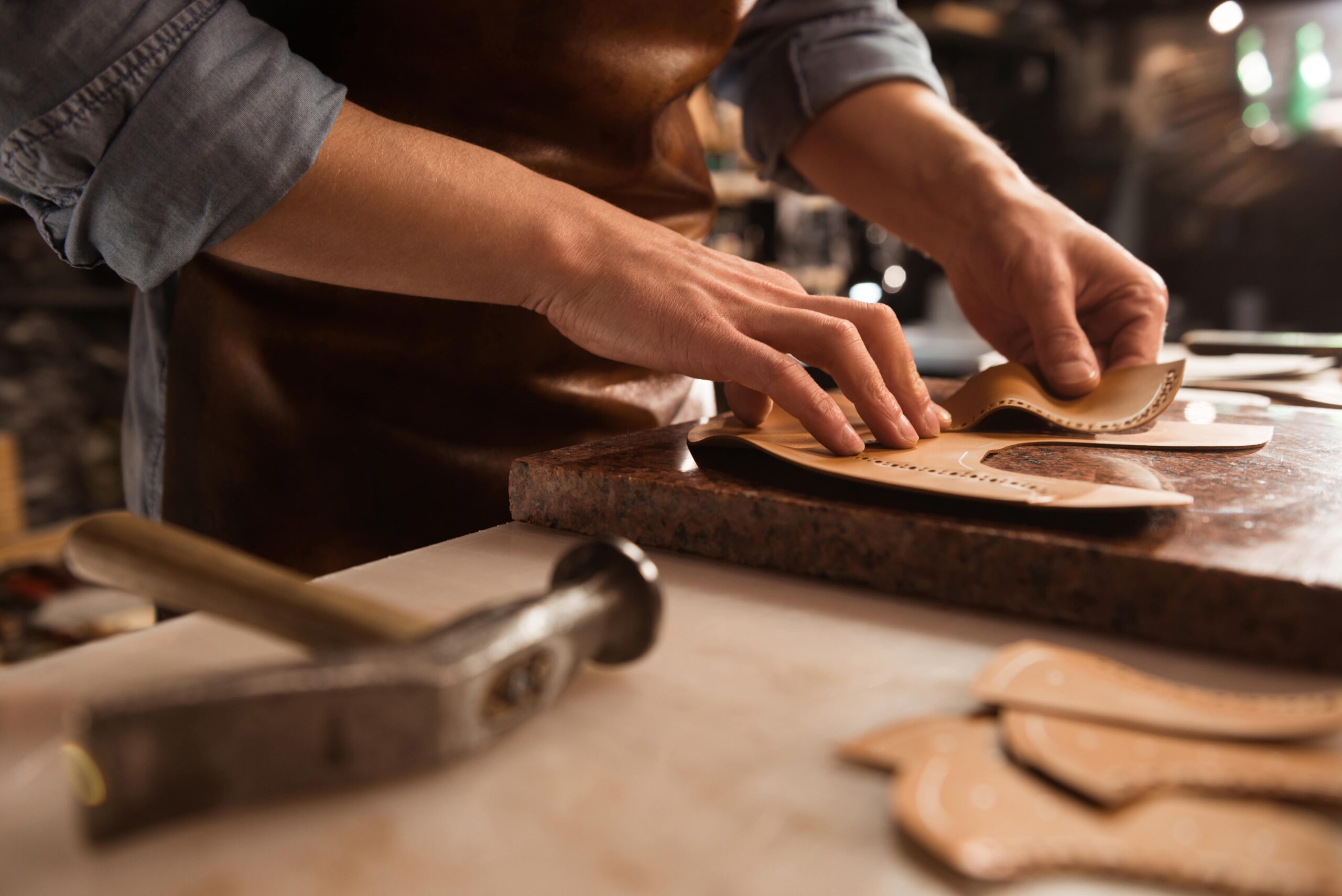 close-up-cobbler-working-with-leather-min